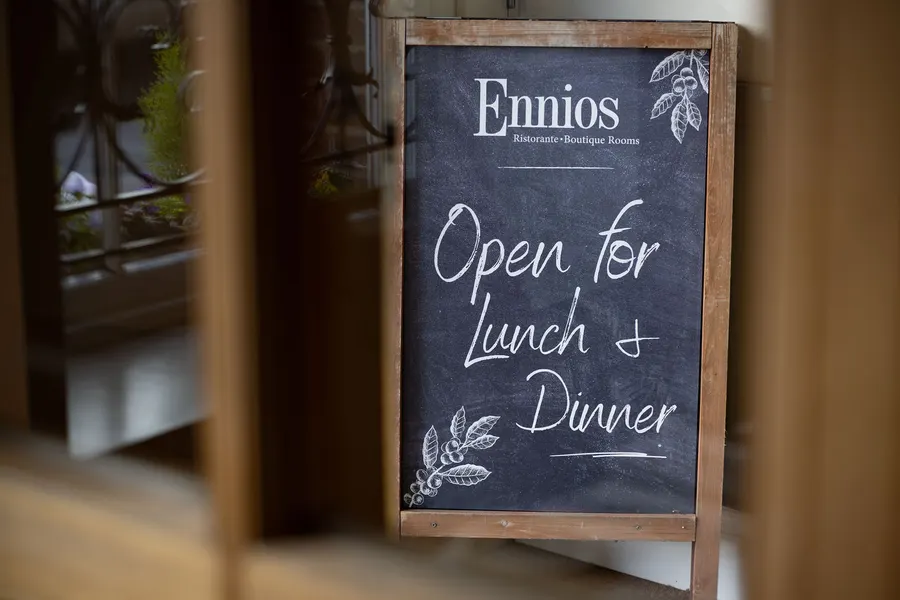 Ennio's chalkboard by the door: open for lunch and dinner