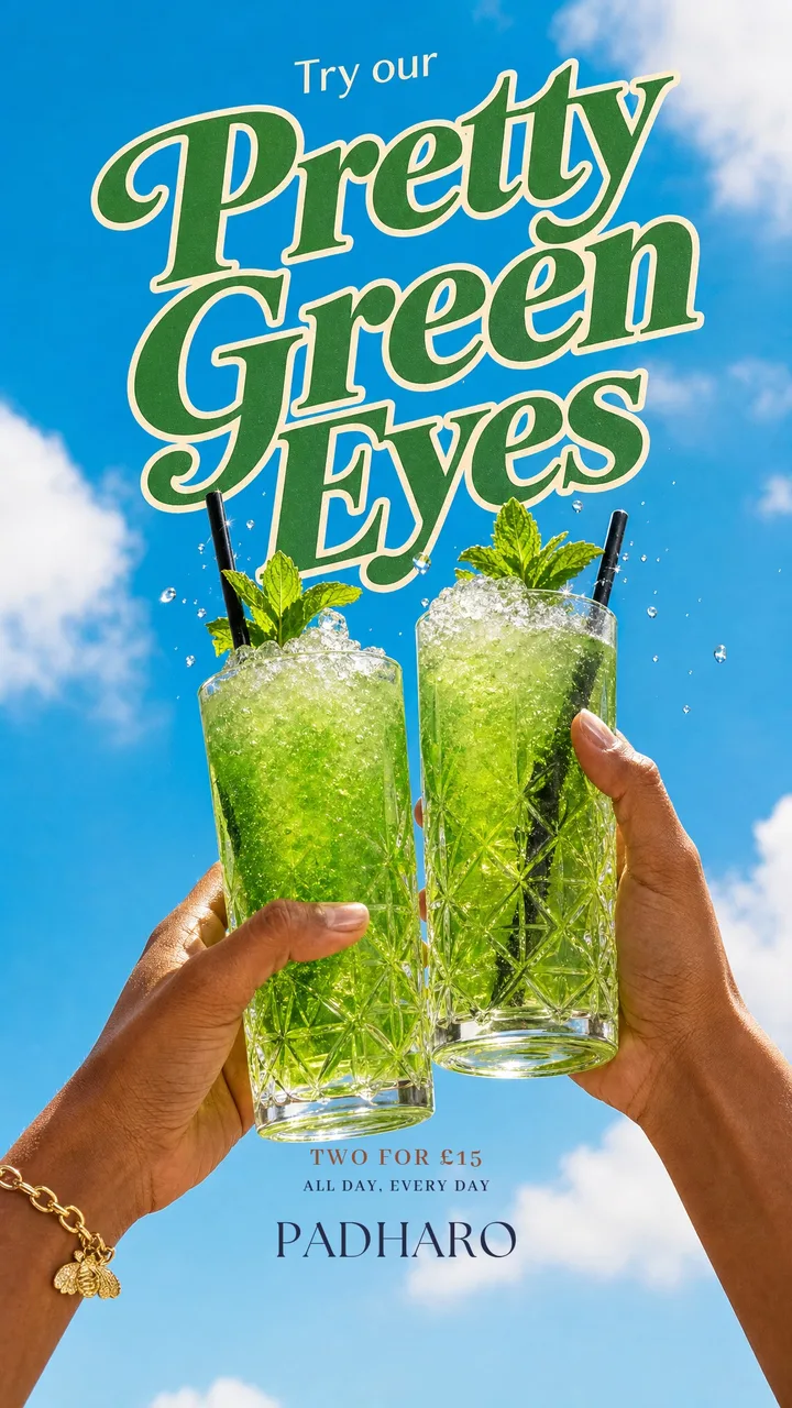 Cocktail story: Pretty Green Eyes, two green mojitos raised against a blue sky